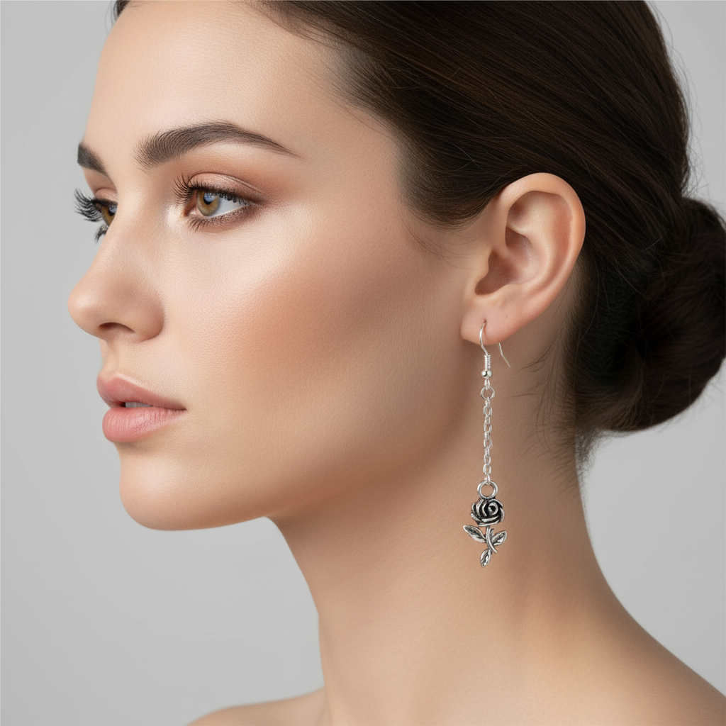 Rose dangle earrings on woman model.