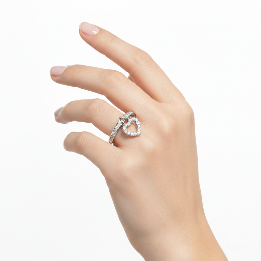 Silver and CZ Heart Charm Ring On A Hand.