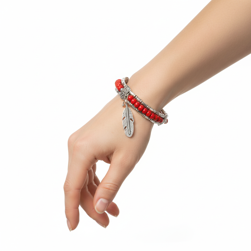 Silver Tibetan Feather Red Beaded Bracelet On A Womans Wrist.