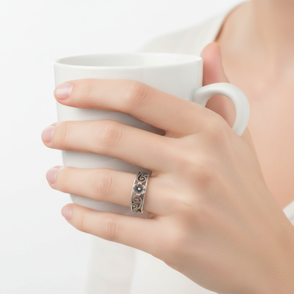 Sterling Silver Antique Flower Ring On A Hand.