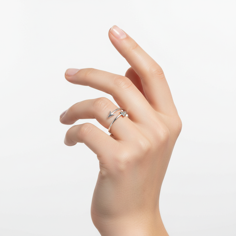 Sterling silver arrow ring on a womans hand.