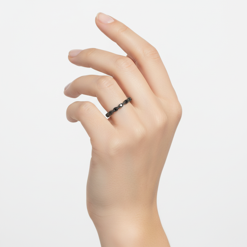 Sterling Silver Black CZ Oval Eternity Ring On a Hand.