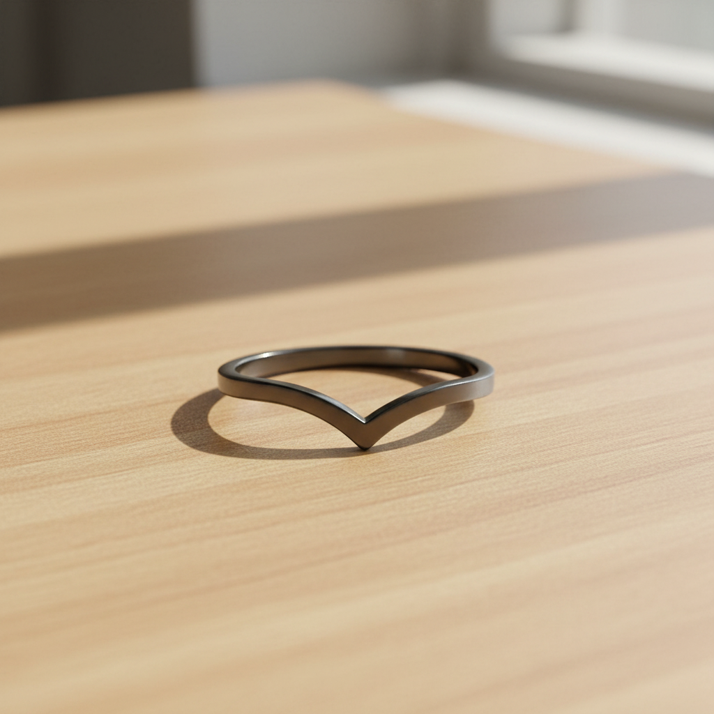 Sterling Silver Black Rhodium V Ring on Light Brown Wood Table