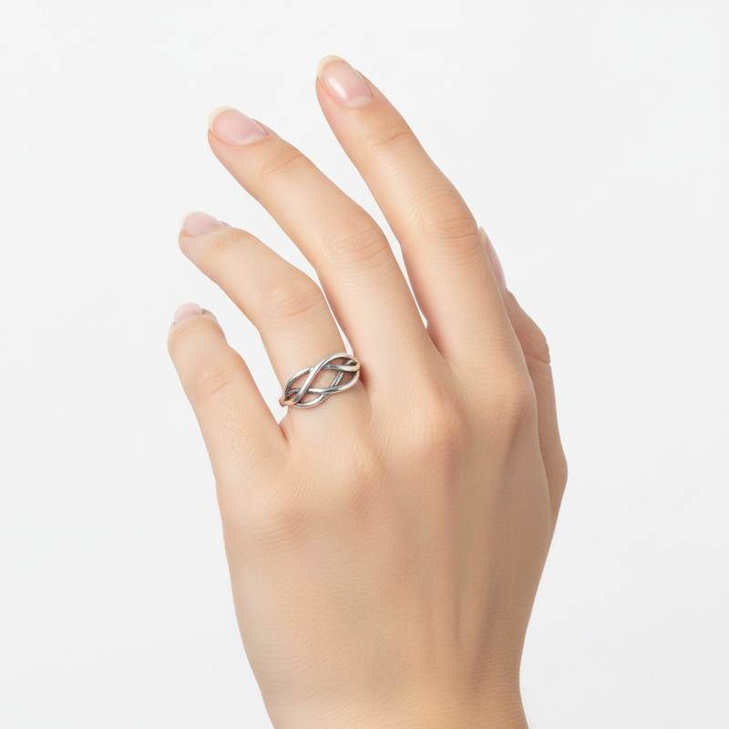 Sterling Silver Celtic Ring On A Womans Hand.