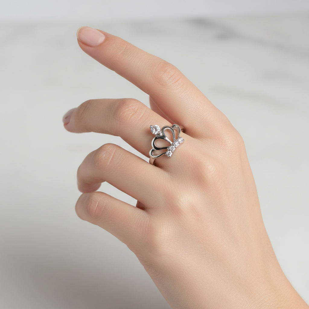 Sterling Silver Crown Ring On a Womans hand.