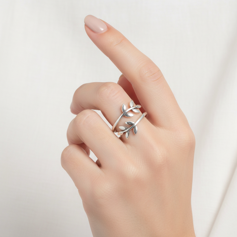 Sterling Silver Leaves Ring On A Hand.