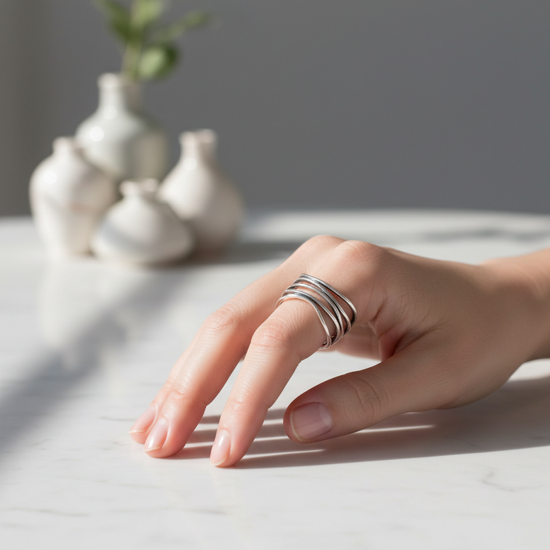 Sterling Silver Multi Wrap Wire Ring On A Womans Hand.