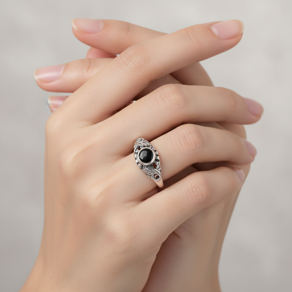 Sterling silver onyx ring on woman's hand