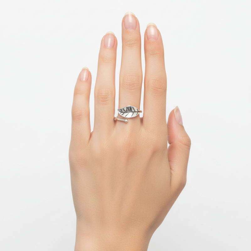 Sterling Silver Single Leaf Wrap Ring On A Womans Hand.