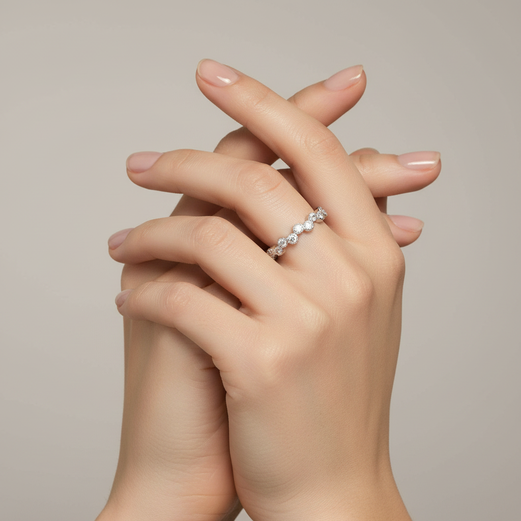 Sterling Silver Wavy CZ Stackable Ring on a womans hand.