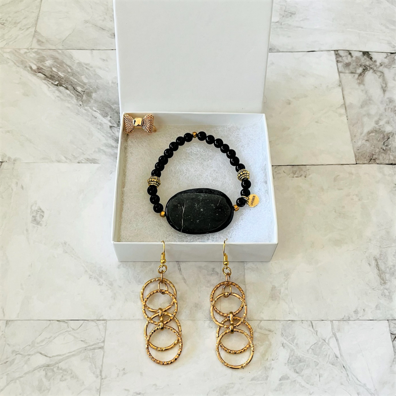 Black Marble Bracelet, Gold Loop Earrings, and Gold Bow Ring